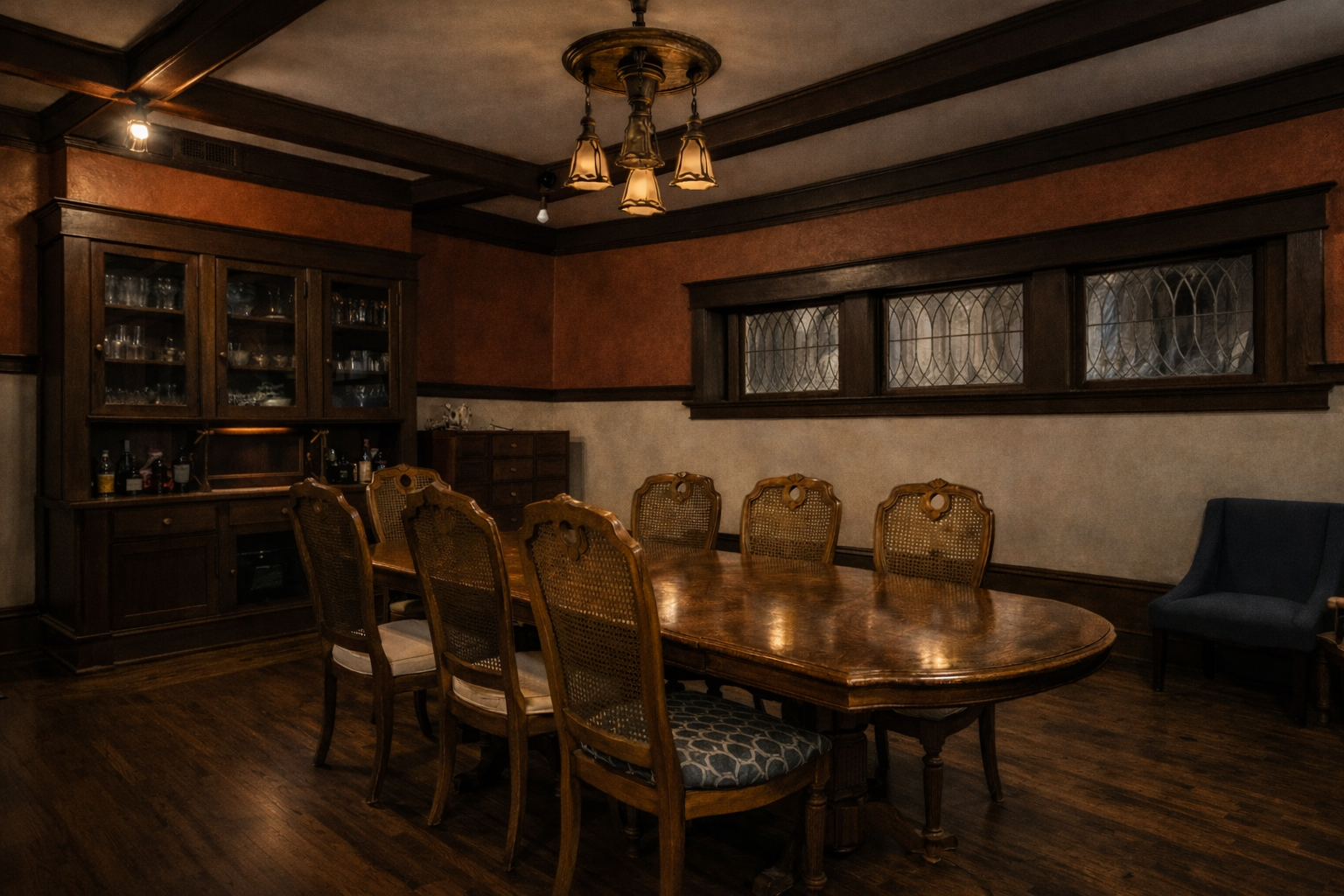 Early 20th-century dining room inside the Fears House with stained glass windows.